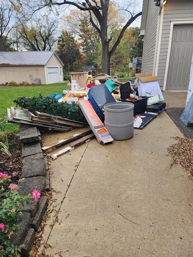Dumpster being loaded with debris for Demolition Dumpster Rental in Bloomsburg